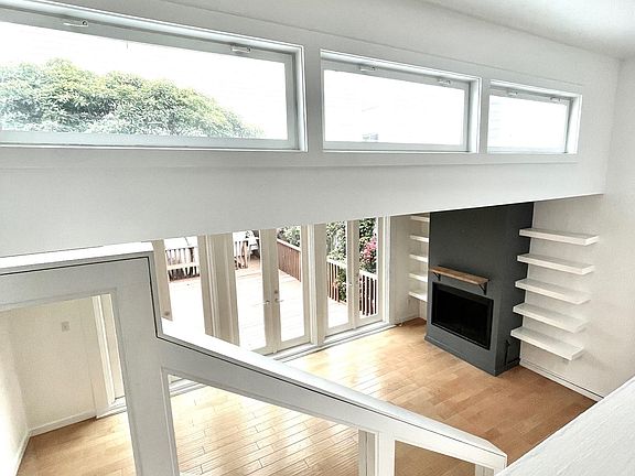 Stairs leading down to living room and outdoor deck