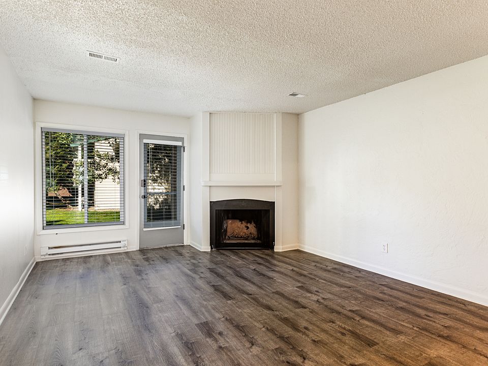 Living room with wood burning fireplace