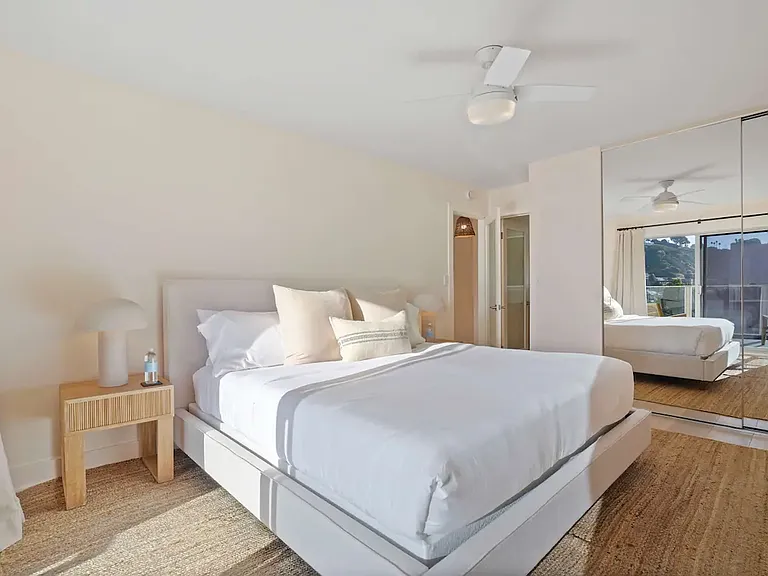 Unwind in the elegantly designed bedroom with a king-size bed and luxury linens.