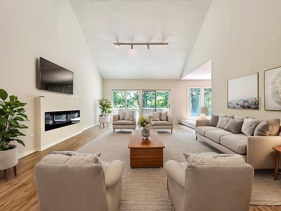 Extra large great room with walk-out balcony overlooking the lake.