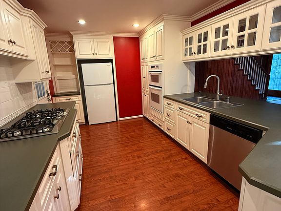 Full kitchen with appliances, oven and stove top