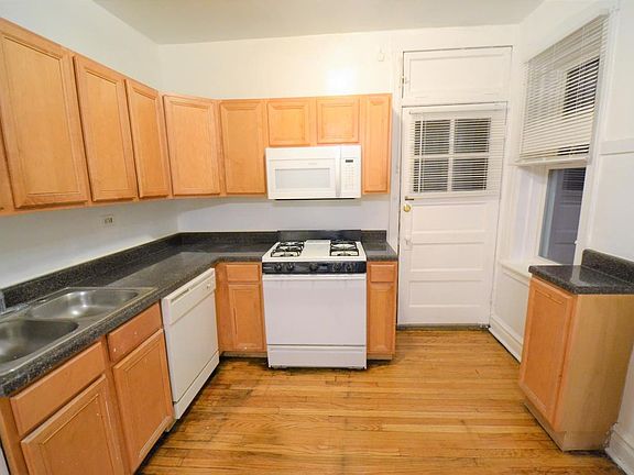 Updated kitchen with newer cabinets and countertops, dishwasher and new fridge on order!