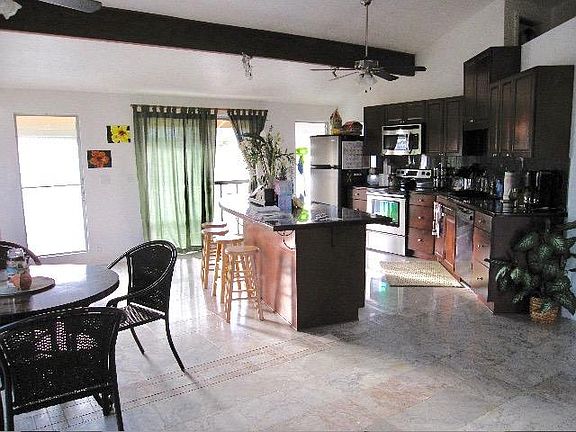 Upstairs 1/2 bathroom located behind table across kitchen