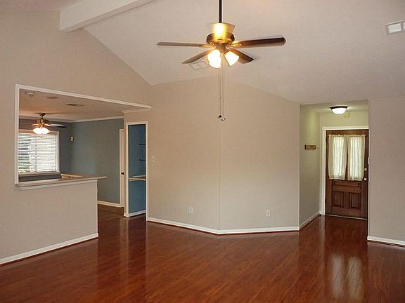 Front  door opens into the den with beautiful laminate wood floors