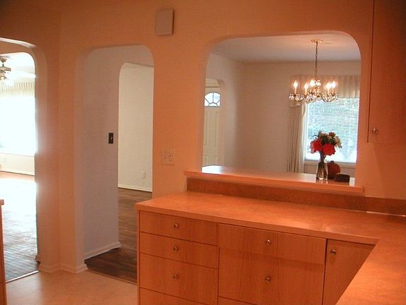 Open, flowing layout connects all the main rooms with the arched doorways.