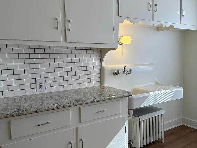 Newly renovated kitchen. New countertop and backsplash.