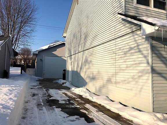 9-Car Garage Behind Home