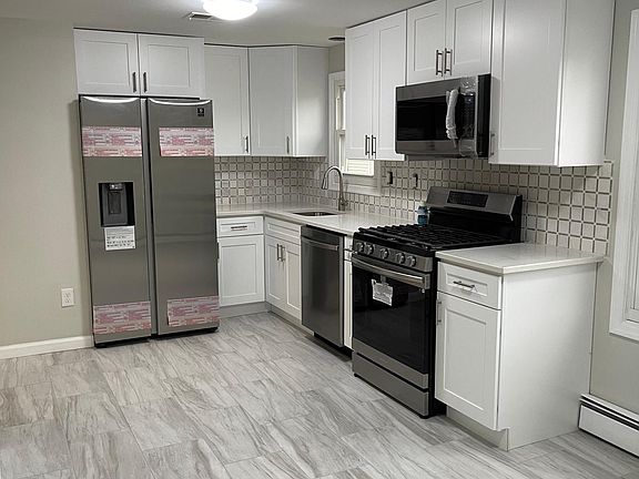 Brand new kitchen cabinets, quartz countertops, brand new Samsung appliances, brand new porcelain tiles
