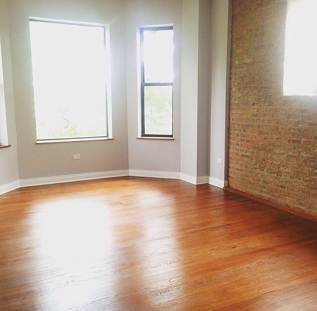 Spacious living room with exposed brick!