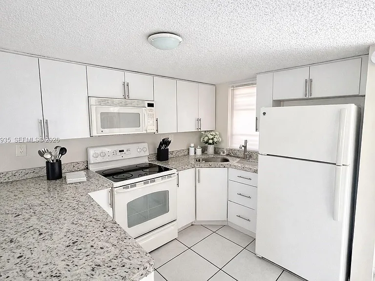 5575 W 26th Ct #203 — Photo 4