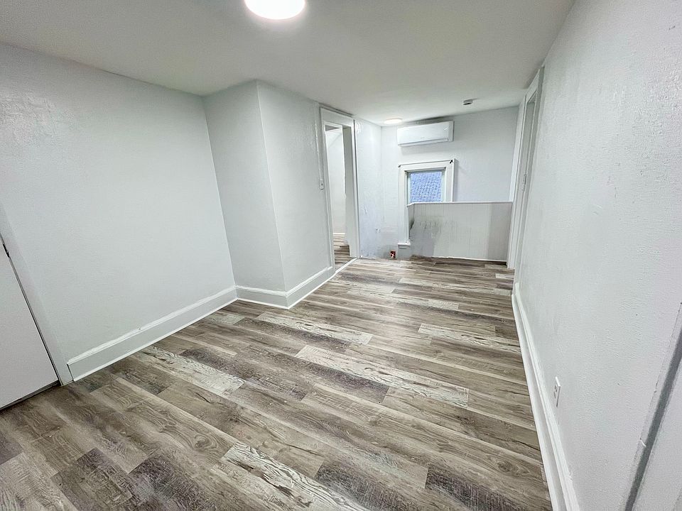 Living room w/ wall a/c and heating unit