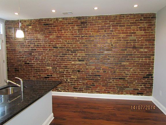 Exposed brick accent wall.