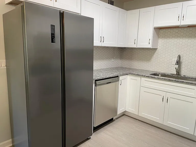 Kitchen with beautiful counter-depth side-by-side large fridge.