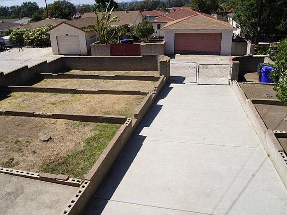 view from deck over garage, backyard faces paved alley