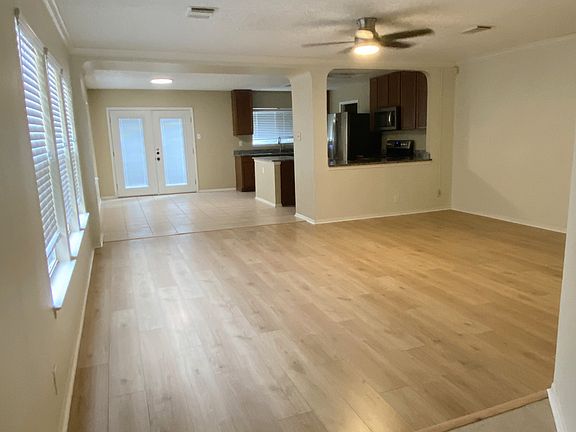 Living room, open floor plan with kitchen in the back