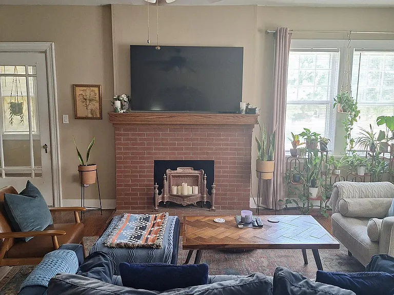 Nice living room with fireplace and beautiful wood floors.