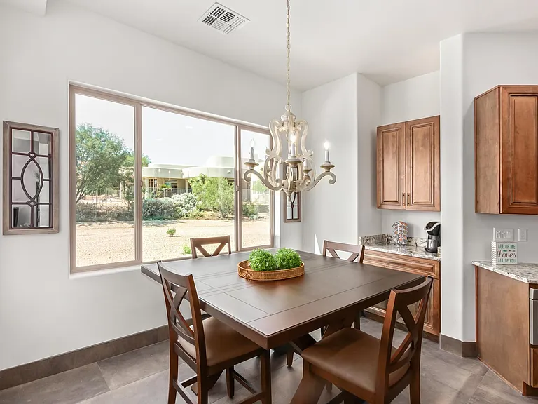 EIGHT PERSON DINING ROOM TABLE AND EIGHT CHAIRS.