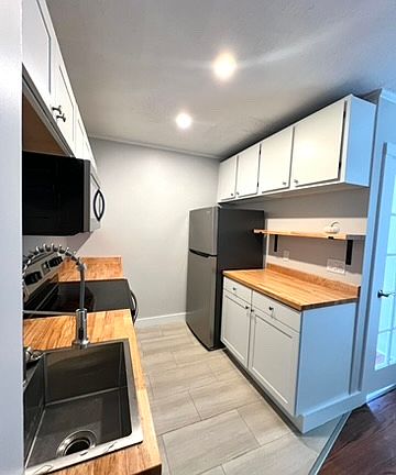 Stainless Appliances and butcher block countertops