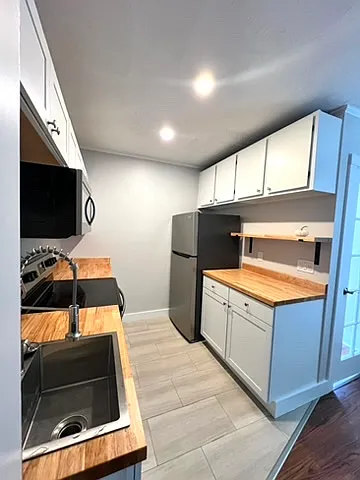 Stainless Appliances and butcher block countertops