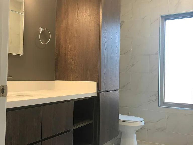 Laminate cabinets, quartz counter tops, floated cabinets, plenty of storage.