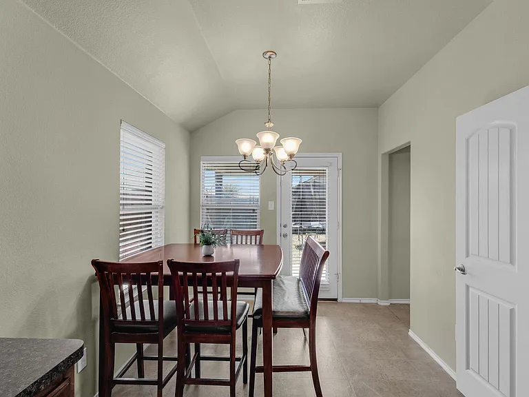 Light bright dining area next to the kitchen