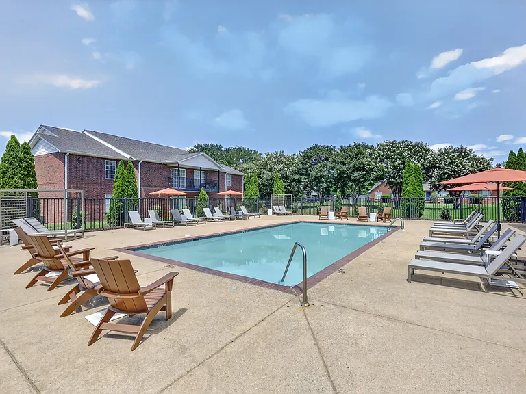 Community swimming pool with an expansive sundeck designed for recreation and relaxation.