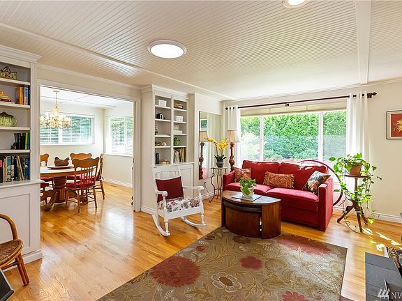 Formal Living room has built in cabinets and pocket door leads into the formal dining room.