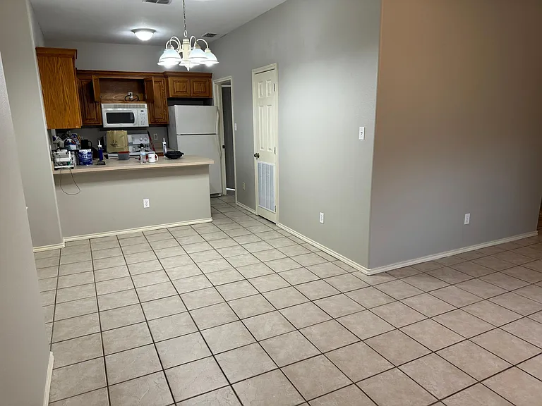From front door looking at dining area and kitchen.