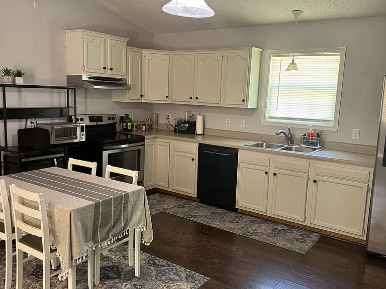 Fully equipped kitchen with modern appliances and efficient workspace.