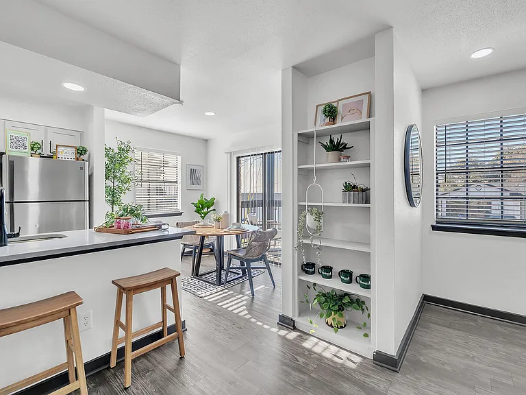 Experience open-concept living with this sleek kitchen and dining space, designed for modern lifestyles.
