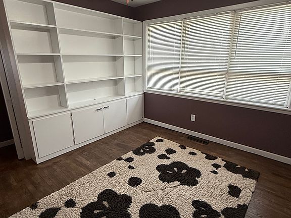 Bedroom 2 with built-in shelves