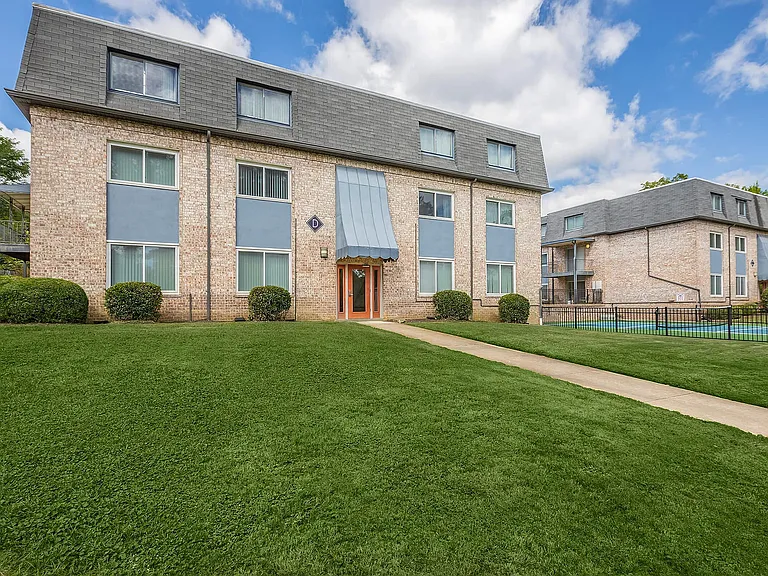Experience comfortable living in this charming brick apartment complex, surrounded by greenery.