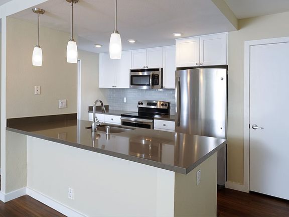 Kitchens With Quartz Countertops Tile Back Splash And Stainless Steel Appliances