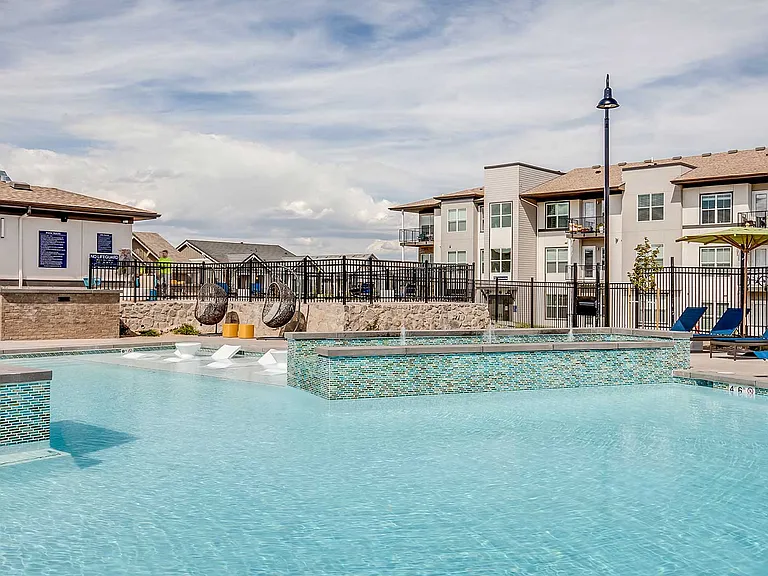 Unwind in a resort-inspired pool retreat featuring expansive sun shelves, modern lounge seating, and beautifully designed community surroundings made for relaxing afternoons and weekend gatherings.