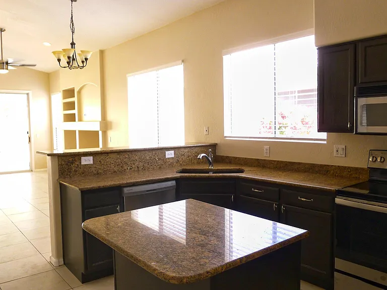 Kitchen with granite countertops and new appliances
