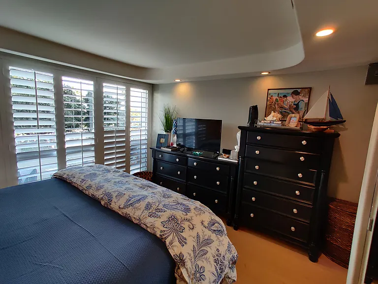 Bedroom with king side bed and lot of storage