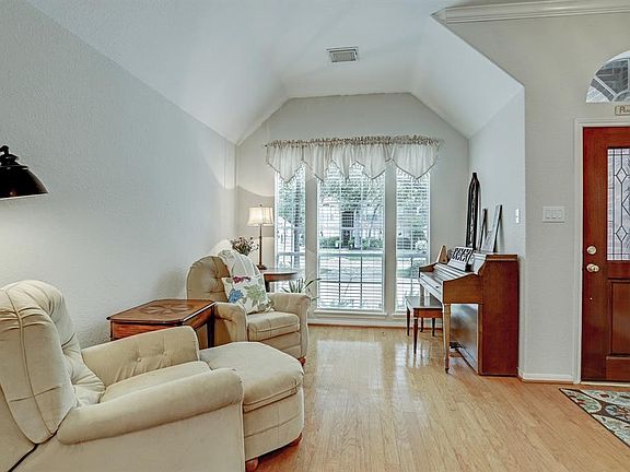 The formal living room overlooks the front yard and gets lots of natural light.