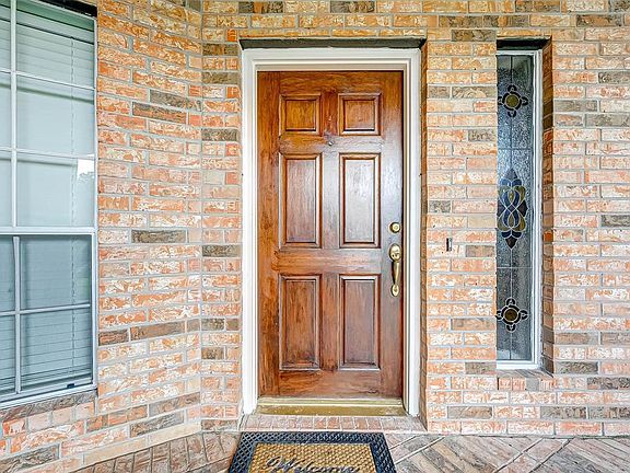 Walk up your Covered front Porch to the Front Door.