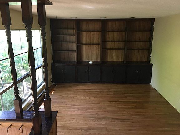 Living room with plenty of space for entertainment, cabinets equipped with spots for cords to pass through