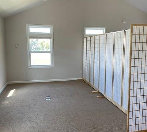 Looking into large bedroom area (approx 11' X 20') from bathroom entry