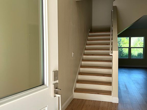 Entrance and stairs leading to the upstairs bedrooms