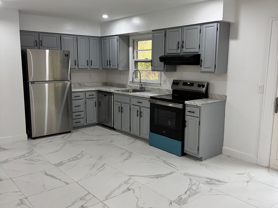 Spacious eat in kitchen with sliding door access to the deck and back yard