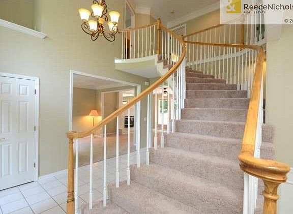 Dramatic Entry with Curved Staircase