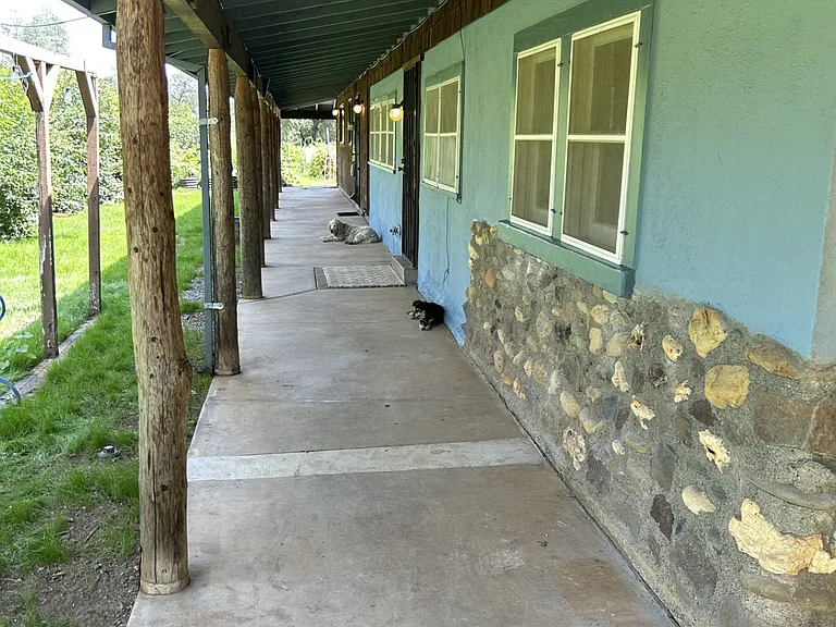 Large covered porches surround the home.