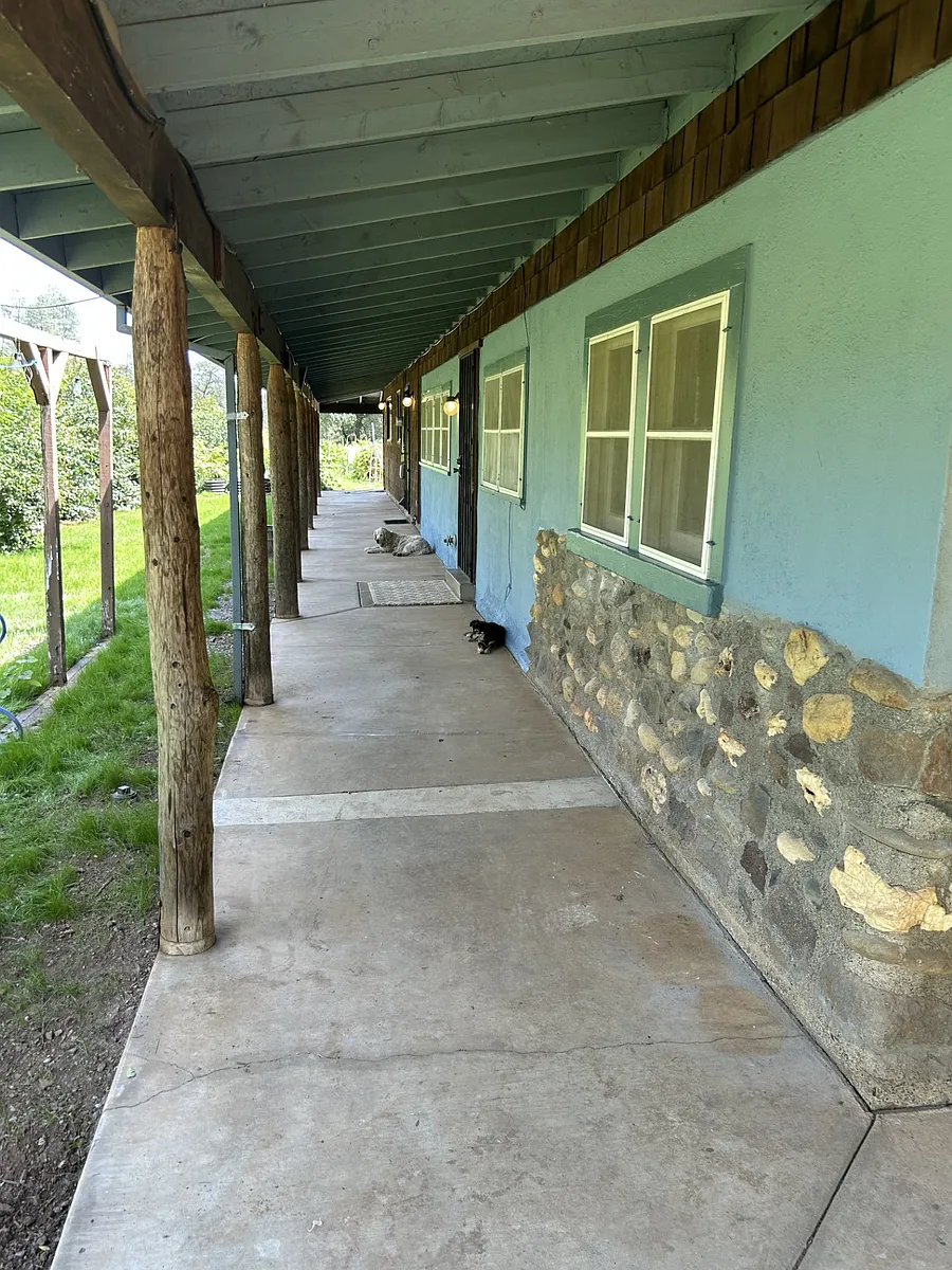 Large covered porches surround the home. - 17549 Flanagan Rd