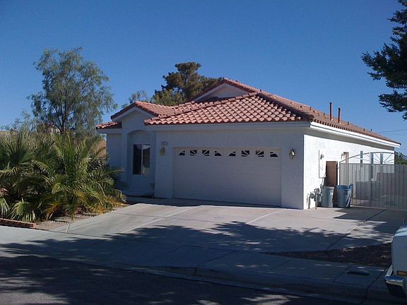 2 car garage with large RV parking.