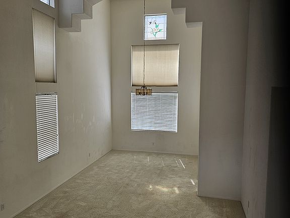 Living and dinning room with tall ceiling