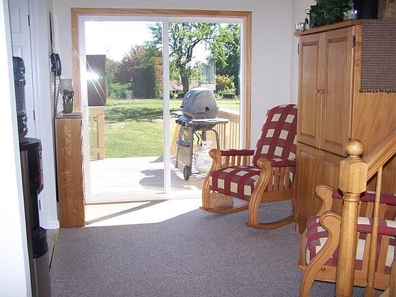 Dining area has sliding glass door to deck.
