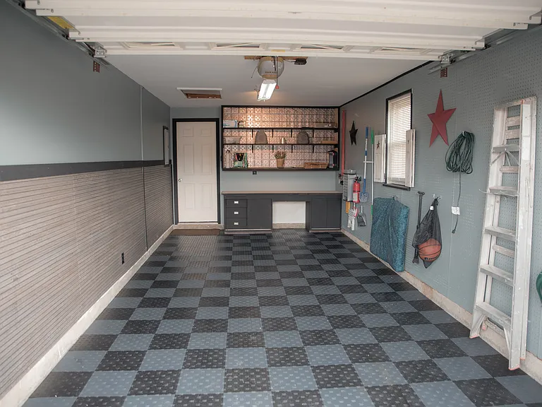 A warm welcome! Our well-maintained garage adds a modern touch and great curb appeal to the home.