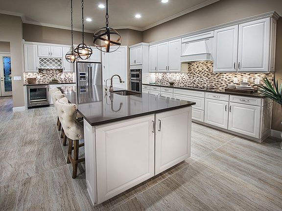 Model Representation Kitchen with large center island and 42 white kitchen cabinets